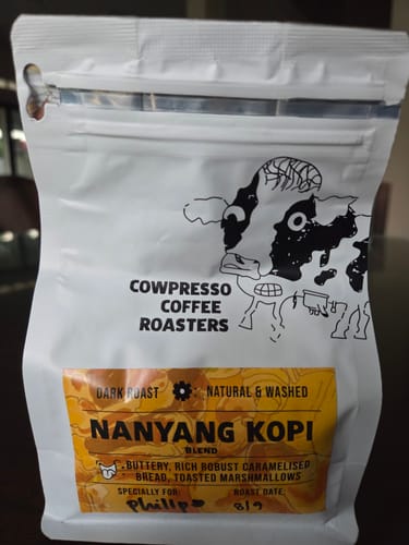 Customer's white pouch of Nanyang Kopi Roast with its bright yellow label.