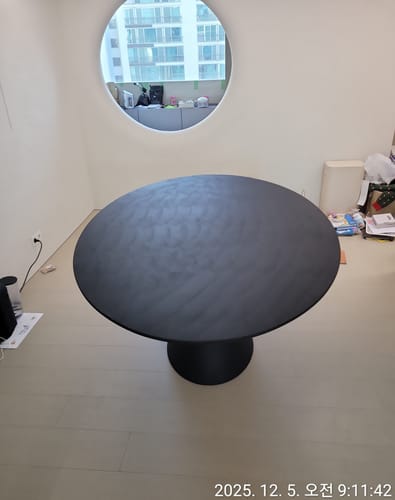 CLAY Oval Table in place within the room.