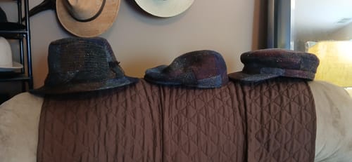 Reviewer's Fisher Cap Tweed (far right) shown with two other tweed hats from their collection.