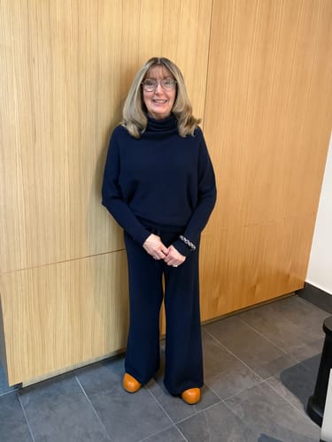 Reviewer showing a front view of the navy Relaxed Pants and matching sweater, highlighting the fit.