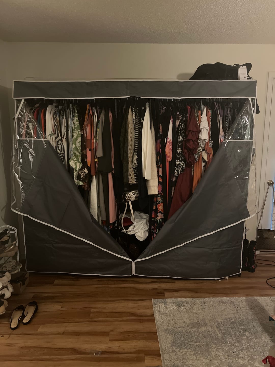 Customer photo review of Raybee 90.6''W Heavy Duty Clothes Rack with Cover,1200lbs Freestanding Garment Rack for Bedroom