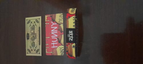 Customer's Hunny Bracelet displayed flat with its colorful collector's card and novelty bill.