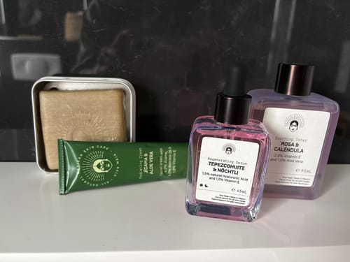 Customer's Barrier Protection Routine products, including a serum, toner, and cream, arranged neatly on a counter.