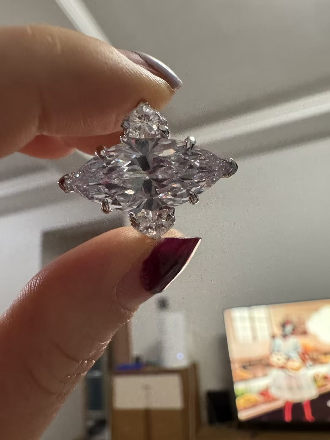 Customer photo review of Louily Marquise Cut Three Stone Engagement Ring In Sterling Silver