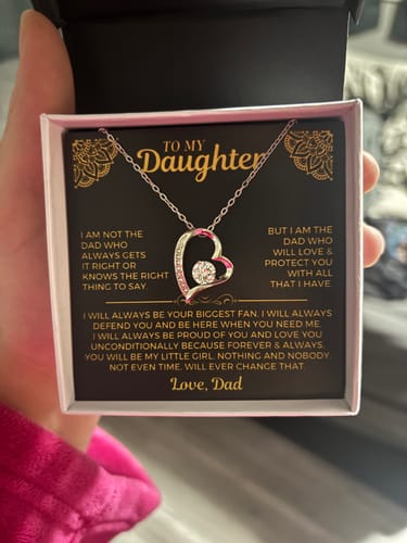 Customer holds the 'To My Daughter' gift set, showing the silver heart necklace and message card inside the box.