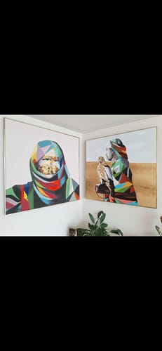 Customer's colorful Falconry painting and the matching veiled lady painting displayed together on a corner wall.