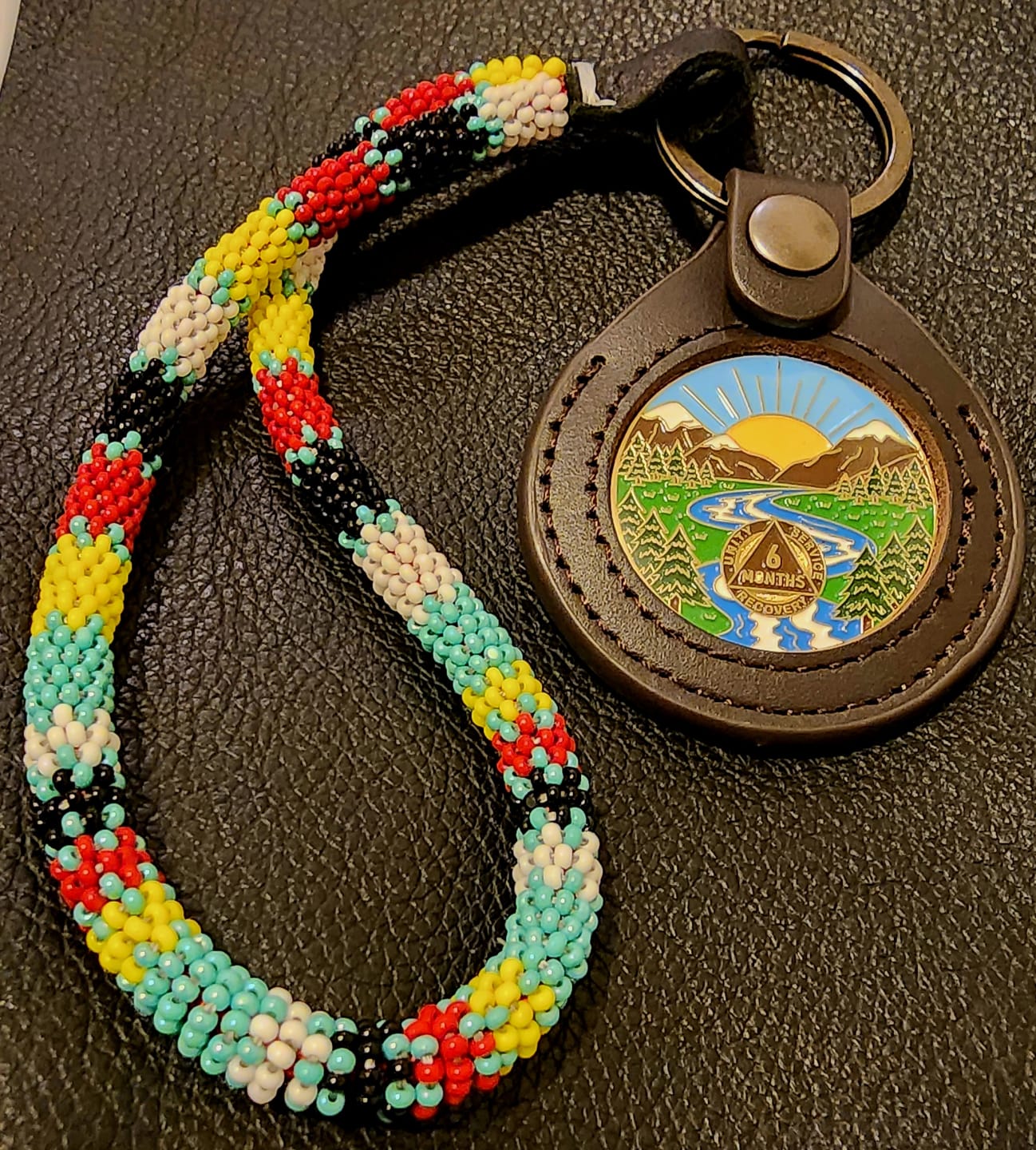 Customer photo review of 1 to 65 Year Sobriety Mint Winding River Gold Plated AA Recovery Medallion/Chip/Coin