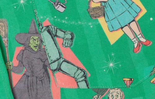 Customer's close-up of the green "Off to See the Wizard" shirt, showing the print with the Wicked Witch and Tin Man.