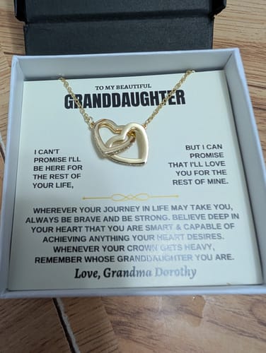Customer's 'Forever Linked Hearts' gift set showing the gold necklace on a personalized message card in its open box.