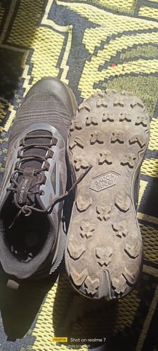 Customer's black Bacca Bucci TrekZON shoes, showing the top of one shoe and the dirty AllTerraX grip outsole of the other.