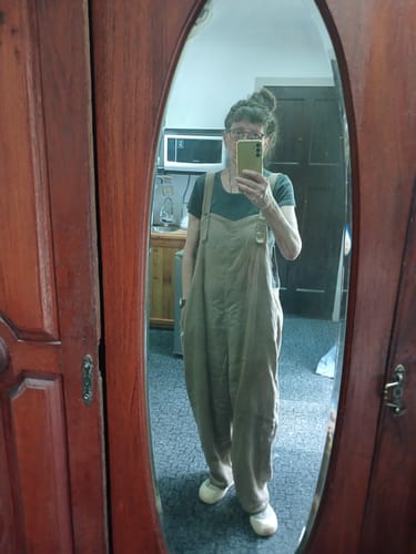 Reviewer's mirror selfie showing the full fit of the loose linen jumpsuit.