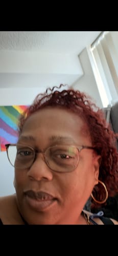 Customer showing their rich, red hair after using the Instant Dye Shampoo.