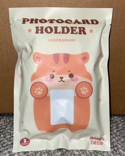 Packaging for the reviewer's Squirrel Plush Photocard Holder, featuring a cute squirrel illustration.