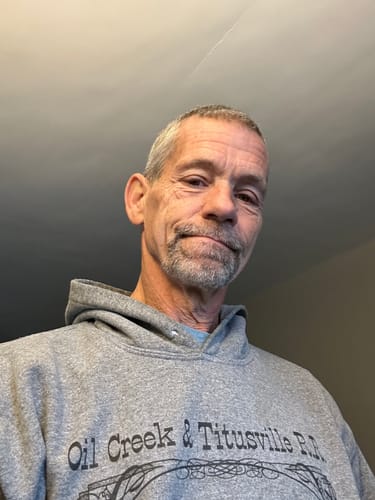 Reviewer with short grey hair and a goatee before using the Instant Dye Shampoo.