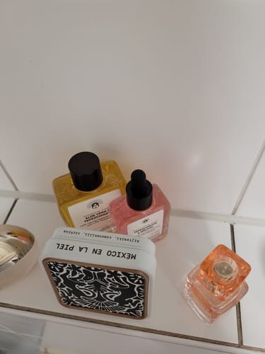Customer's Mexican Skincare Bestseller products, including the serum and cleanser, on a tiled counter.