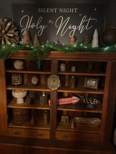 Reviewer's Tailored Boost canvas with 'Silent Night Holy Night' text displayed on a hutch with Christmas decor.