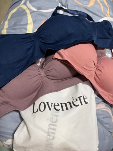 Customer's Mère Seamless Starter Kit showing three bras in navy, dusty rose, and mauve, with a brand tote bag.