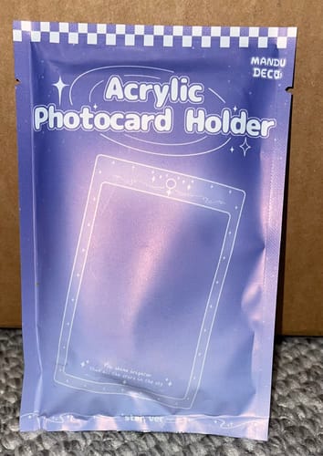 Packaging for the reviewer's ACRYLIC PHOTOCARD HOLDER shown in its purple resealable bag.