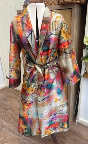 Customer's colorful robe made from Sunset Garden Faux Silk Fabric, displayed on a dress form.