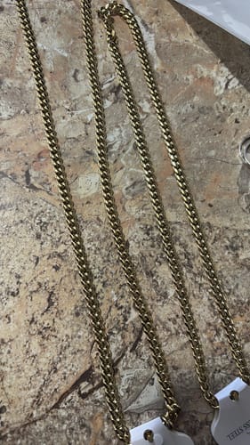 Customer's close-up of the 6mm 14K Gold Miami Cuban Chain laid out on a countertop.