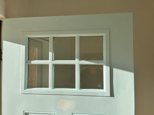 Customer's new Clear 6 Lite Glass and Frame Kit installed on a light green door.