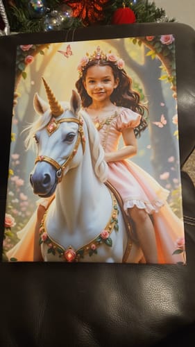 Customer's The Enchanted Unicorn Princess canvas print showing a smiling girl on a white unicorn.
