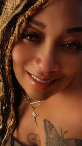 A happy reviewer smiling after receiving their custom song from CREATE YOUR MELODY.