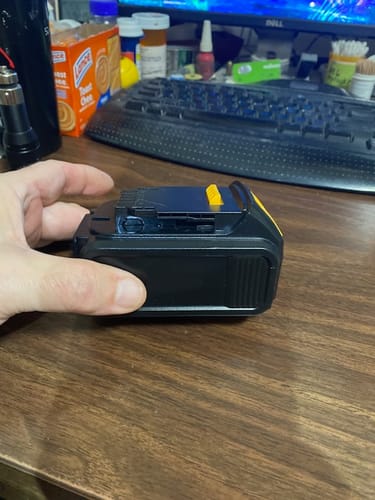 Reviewer holding the completed custom tool battery pack built using Molicel P30B batteries.