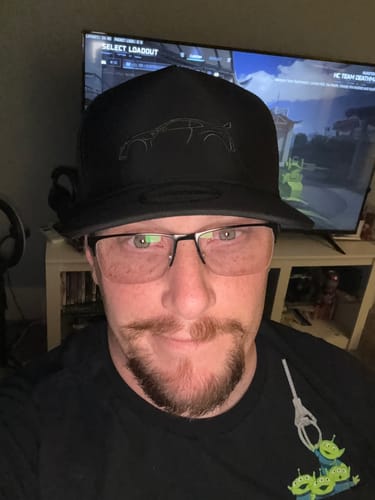 A close-up of a reviewer wearing the black 80Eighty Limited Edition DCG#84 Hat.