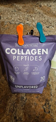 Customer's bag of unflavored Collagen Peptides clipped closed on a kitchen counter.