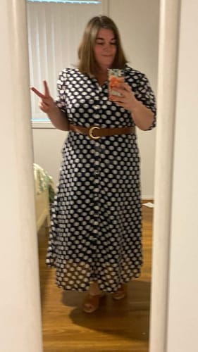 Reviewer wearing the Fallon Shirt Dress in navy and white polka dot, styled with a brown belt.