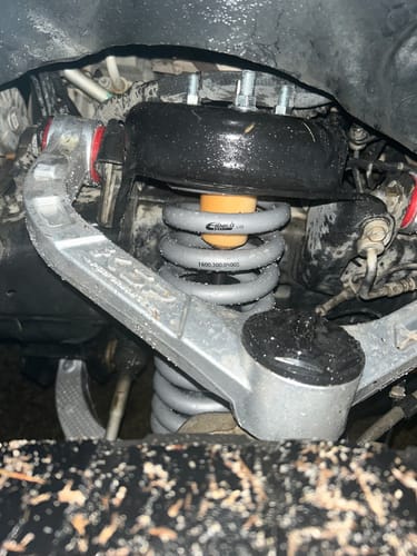 Customer's installed forged aluminum upper control arm on the front suspension of a Ram 1500.
