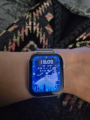 Customer's Gard Pro Health Smartwatch 3 on their wrist, showing a custom winter-themed watch face.