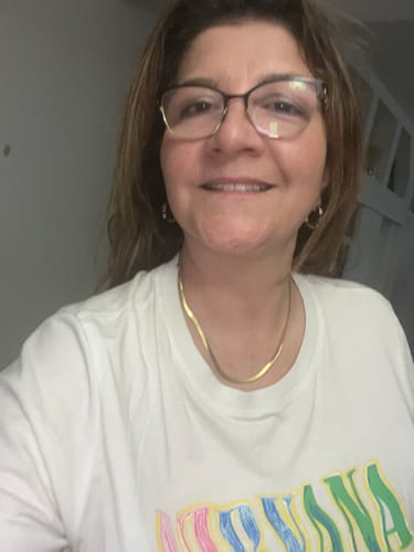 Reviewer wearing the sleek, gold Essentials Snake Chain Necklace with a white t-shirt.