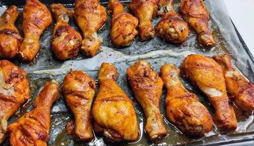 Customer's seasoned Halal Chicken Drumsticks baked on a sheet pan.