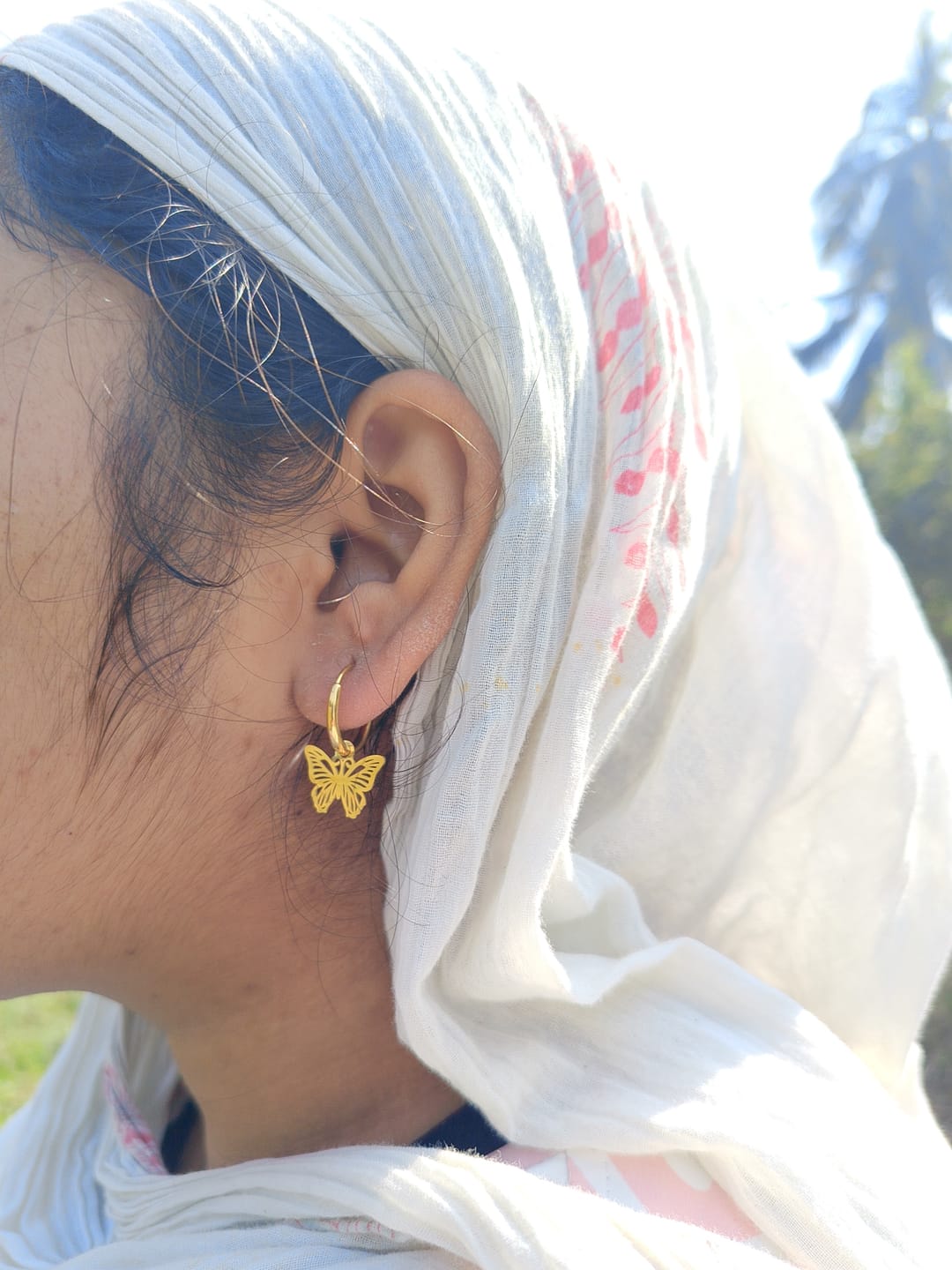 Customer photo review of Sylvia Butterfly Hoop Earrings