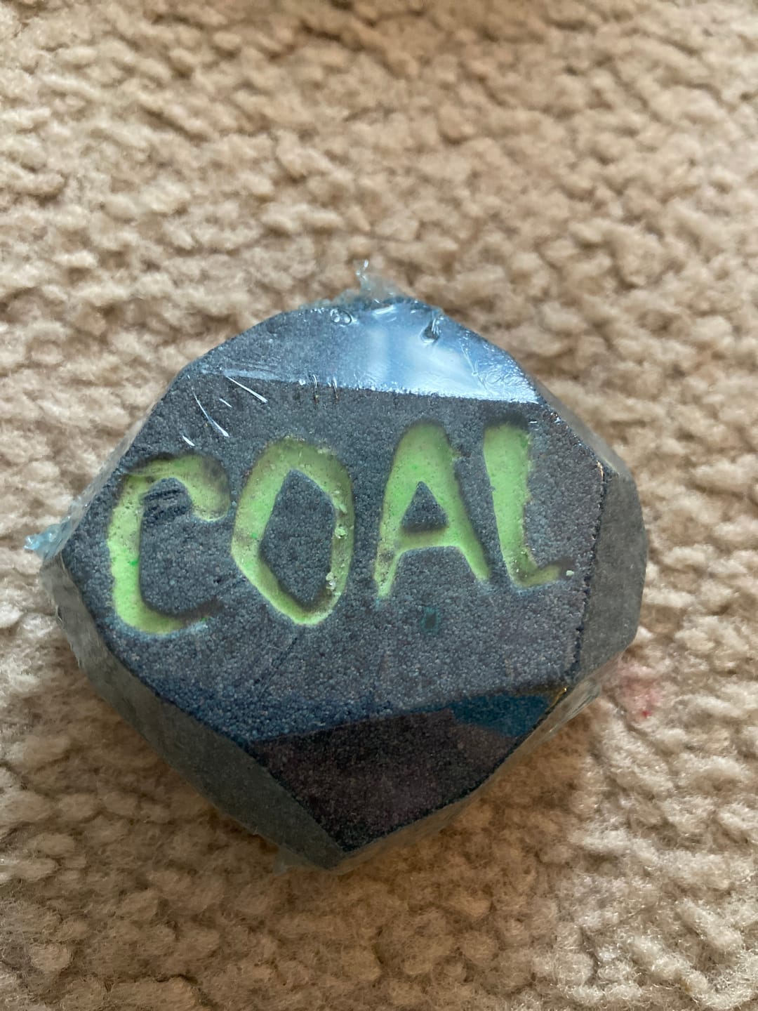 Customer photo review of Lump of Coal Christmas Kids Bath Bomb with Grinch Toy Inside