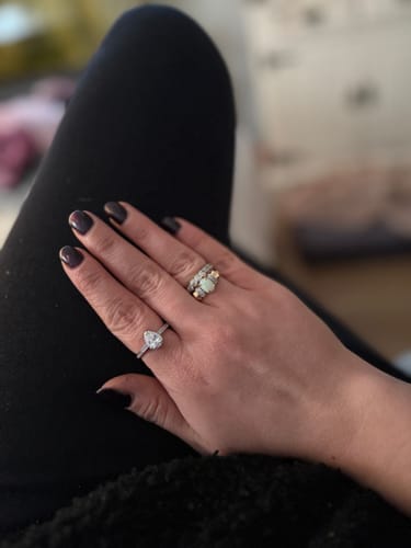 Reviewer's hand wearing the silver Teardrop From Heaven Urn Ring.