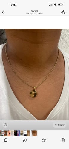 Customer wearing the gold Engravable Classic Disc Necklace with an engraved pendant.