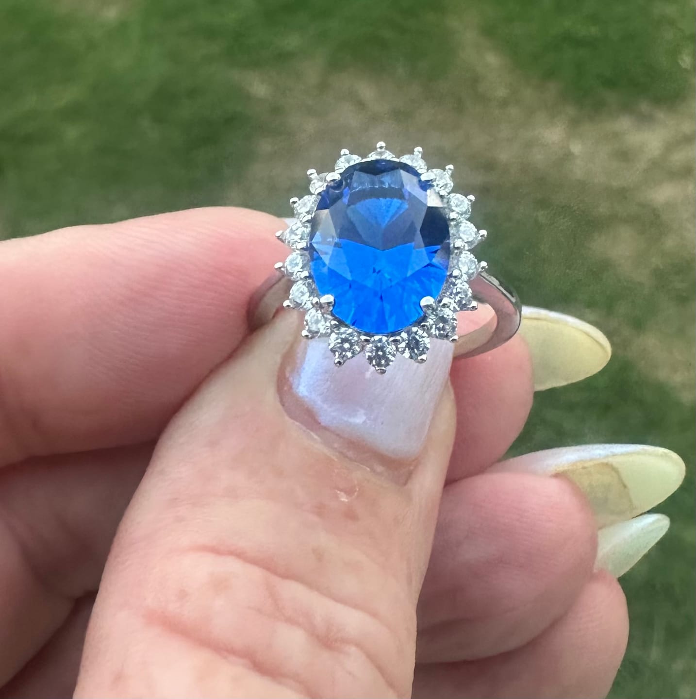 Customer photo review of 4.5 Carat Halo Oval Cut Blue/Red/Green/Yellow Sapphire Engagement Ring In Sterling Silver