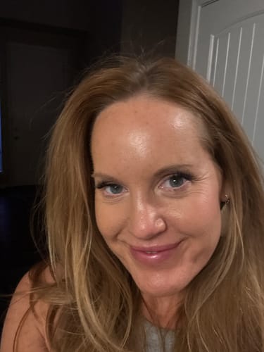 Customer's selfie showing the full, curled effect of her 13mm Extreme Gossamer® lashes.