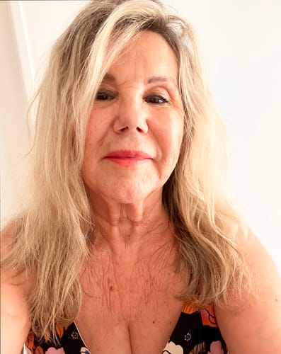 Reviewer shows her hydrated skin on her face, neck, and décolletage after using Sea Buckthorn Serum.