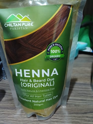 Reviewer's photo of the Chiltan Pure Organic Henna Hair & Beard Dye in its green product pouch.