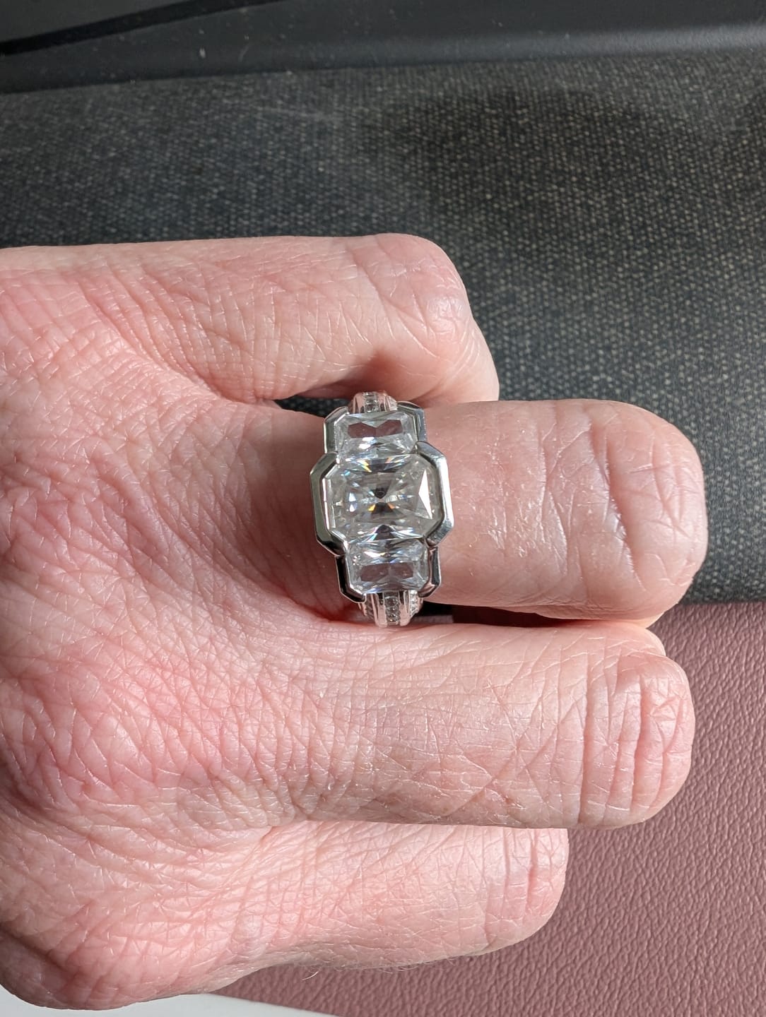 Customer photo review of Three Stone Radiant Moissanite Staircase Channel Set Euro Engagement Ring