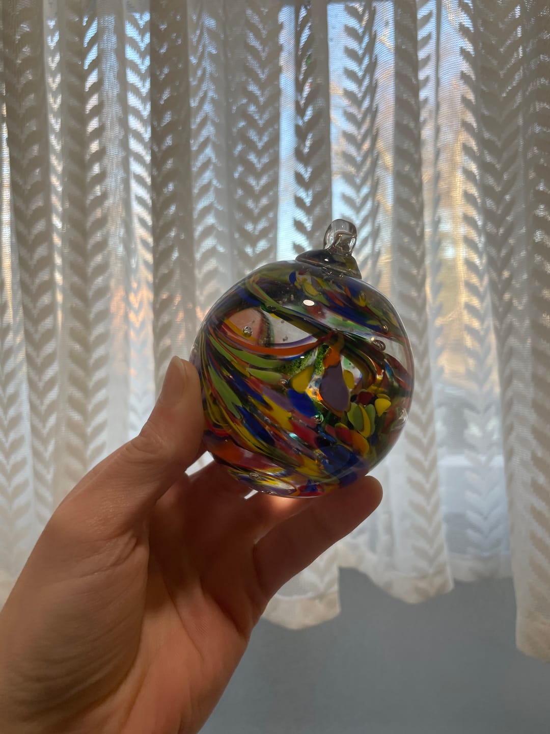 Customer photo review of Rainbow Confetti Orb with Cremation Ashes