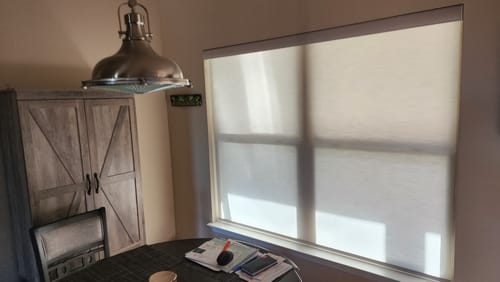 Customer photo review of SmartWings Motorized Light Filtering Roller Shades 70% Blackout Safari