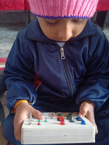 Customer photo review of Montessori Toggle Play Busy Board-V6