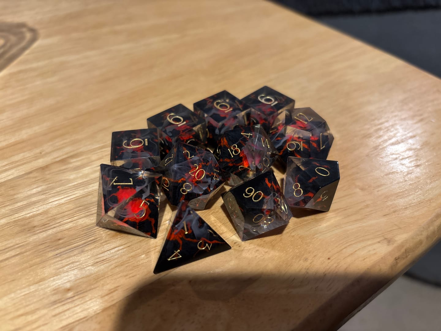 Customer photo review of URWizards D&D Resin Engraved Dice Set Mysterious Realm - Glowing Death Volcano