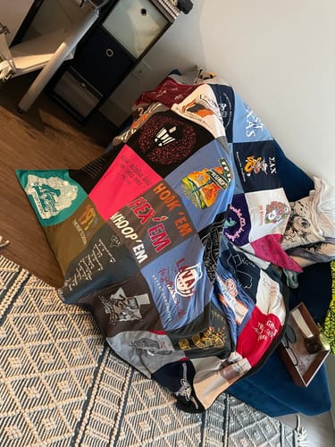 T-shirt quilt with sports, music themes by Laura from TX