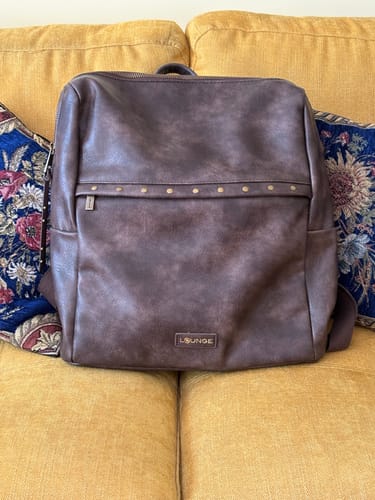 Reseña con foto de un cliente sobre Mochila Notebook Tachas Boho